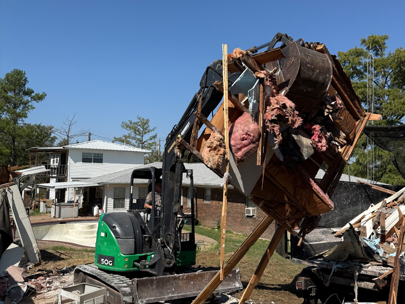 moving brush and debris for clean site